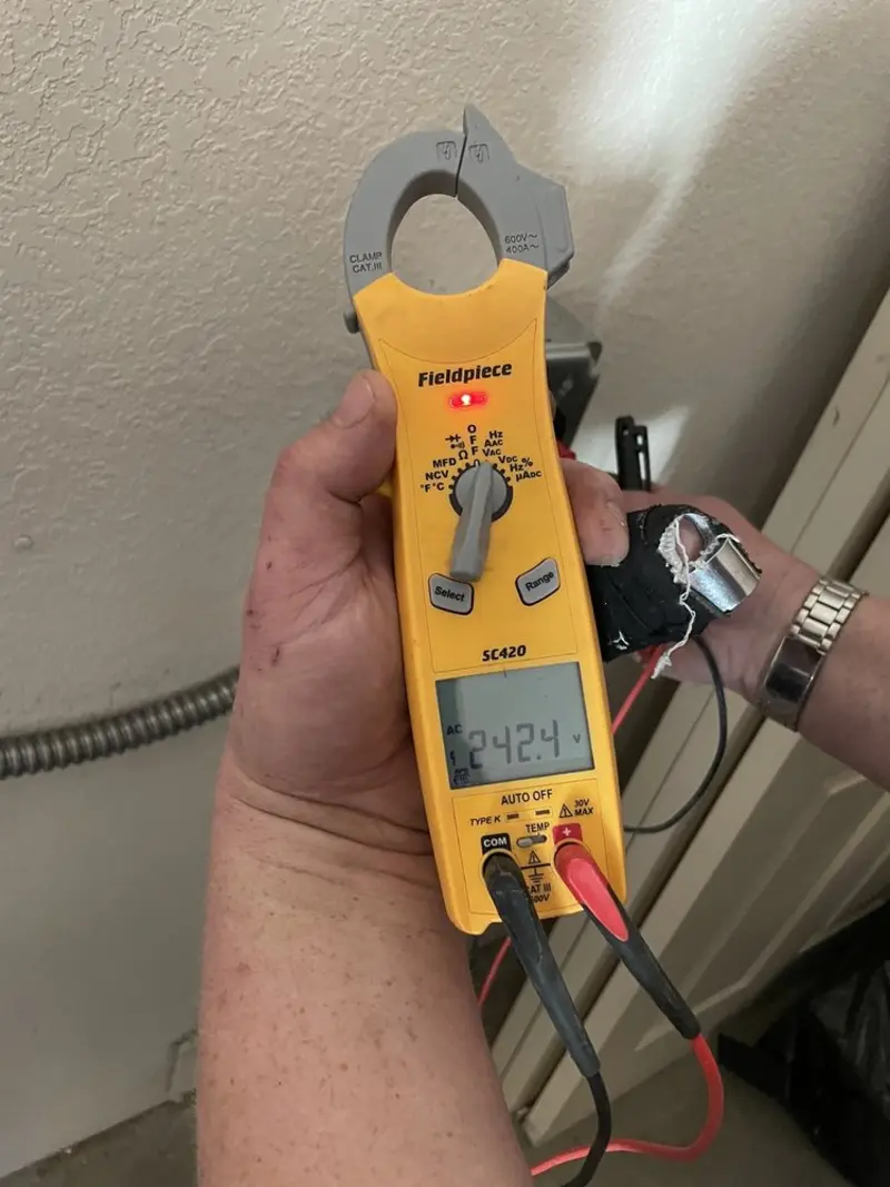 Voltage testing with clamp meter during Ceiling Fan Installation in Lewisburg